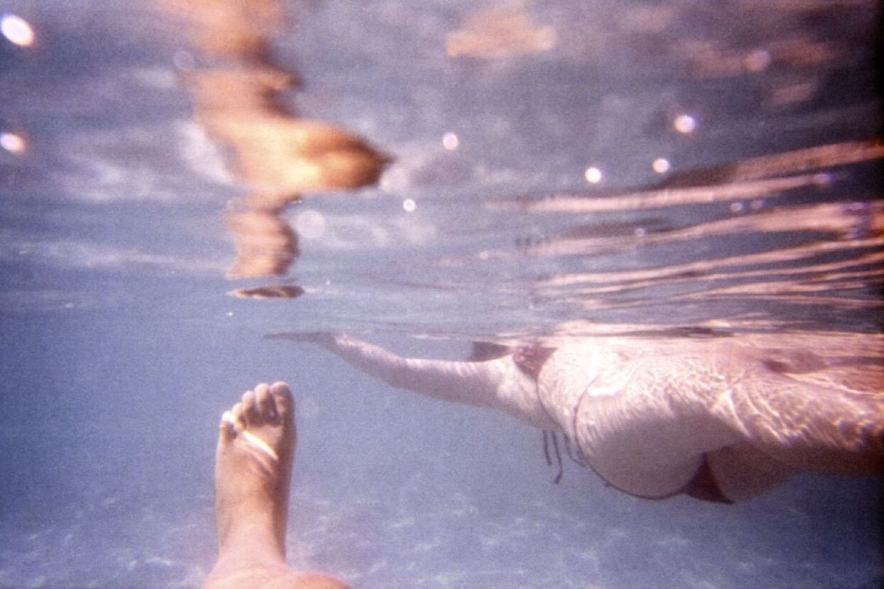 People swimming underwater