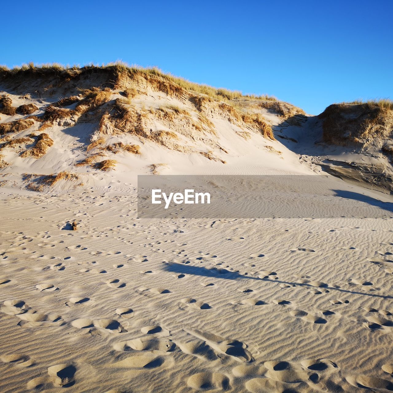 Scenic view of desert against clear sky