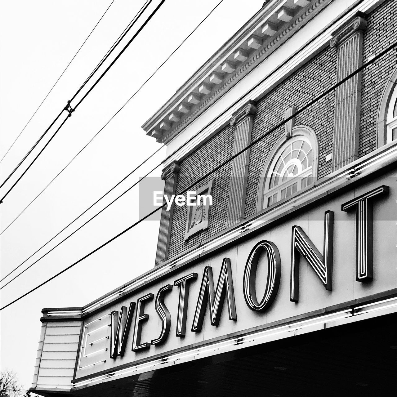 LOW ANGLE VIEW OF TEXT ON BUILDING