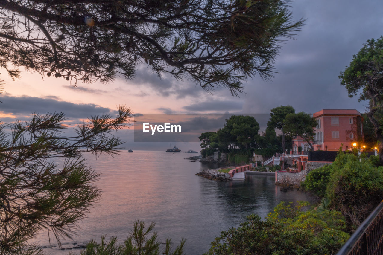 Scenic view of sea and buildings against sky