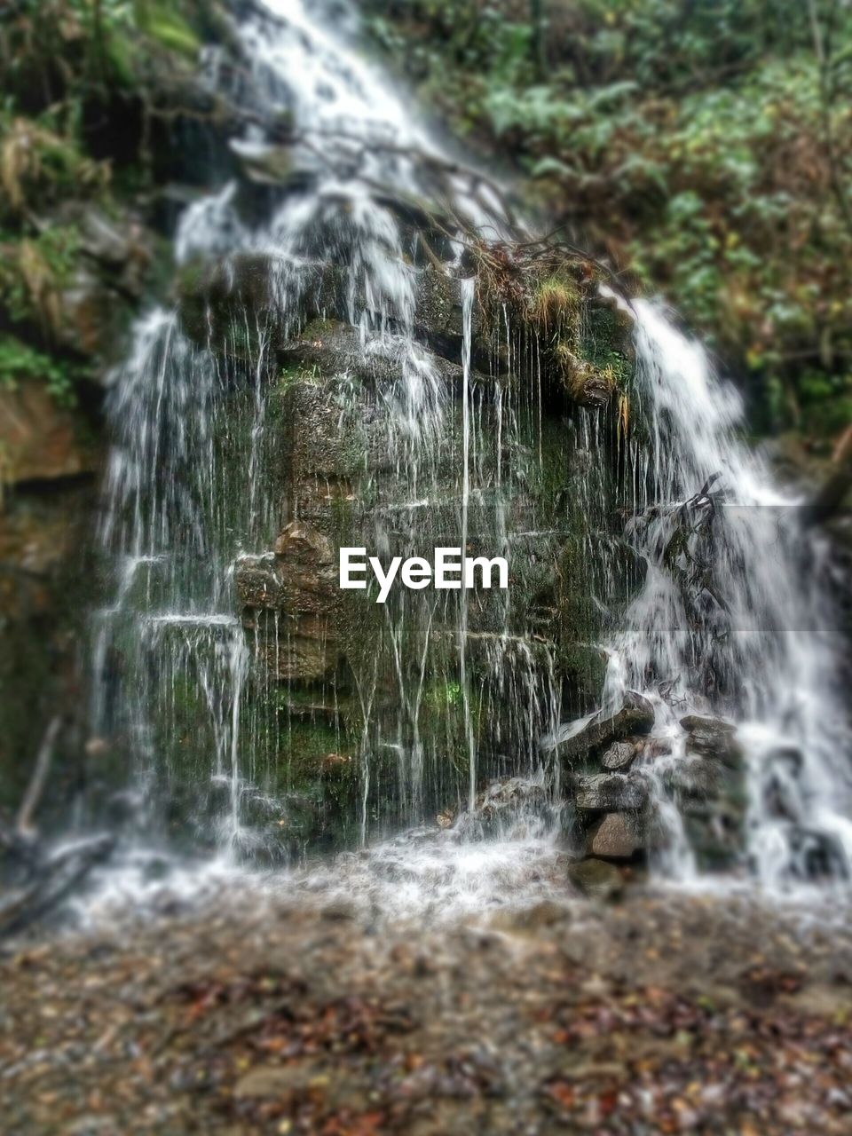 WATER FLOWING THROUGH ROCKS