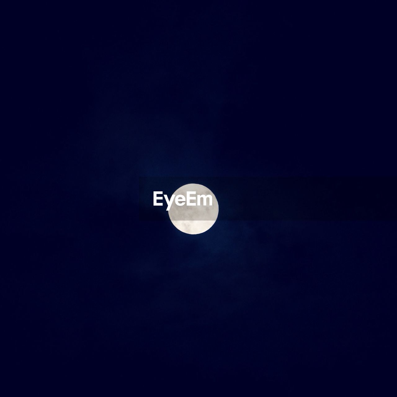 Low angle view of idyllic moon at night