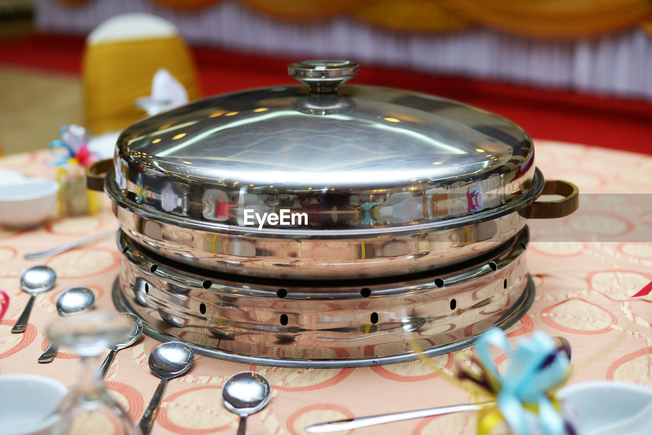 High angle view of container on table with eating utensils