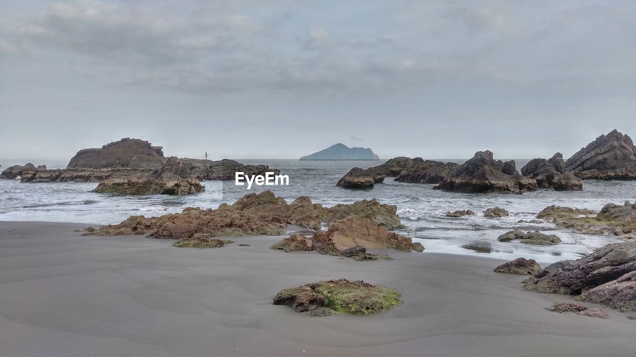 Scenic view of beach against sky