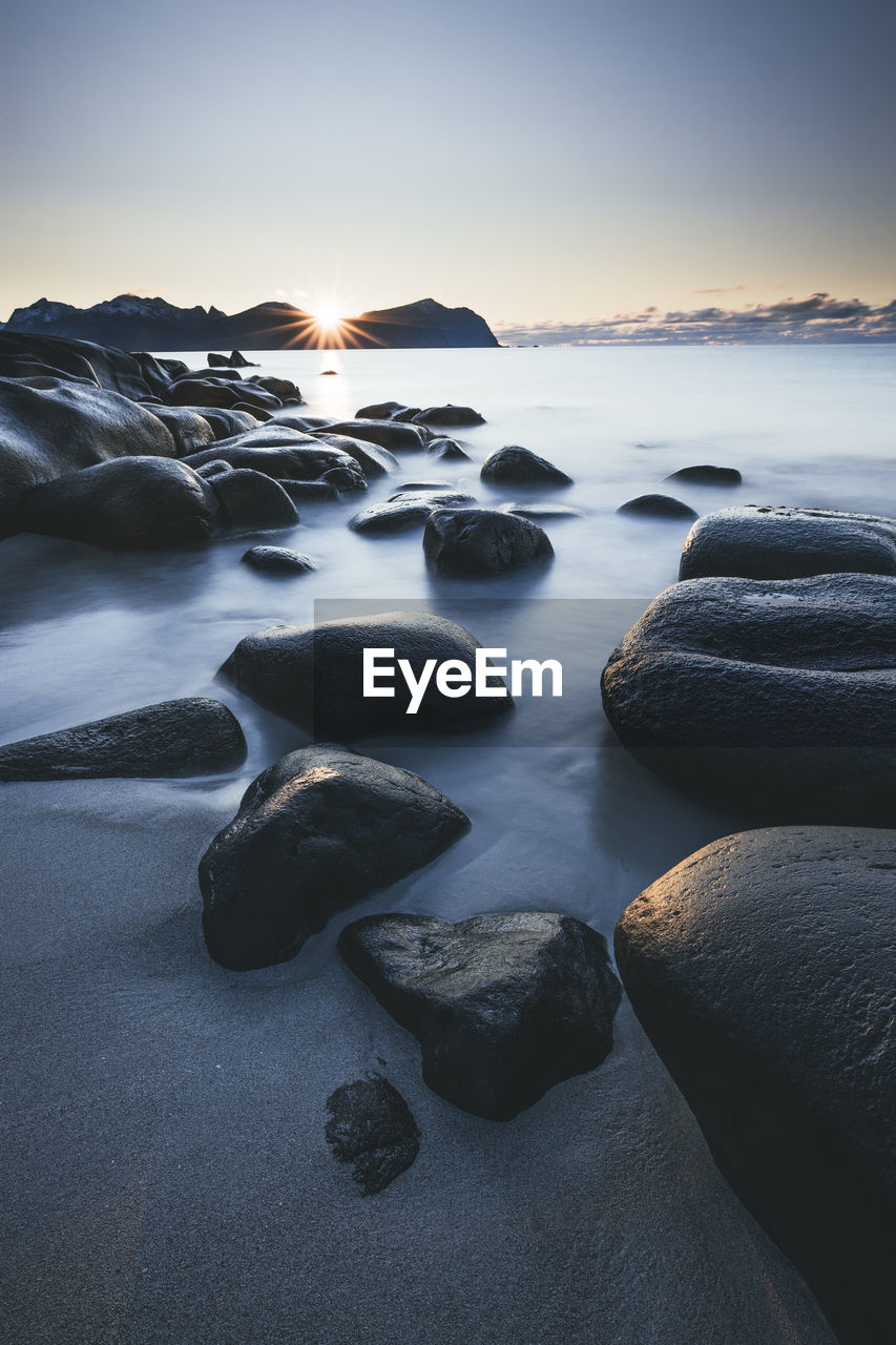 Rocks and water in vareid beach in lofoten