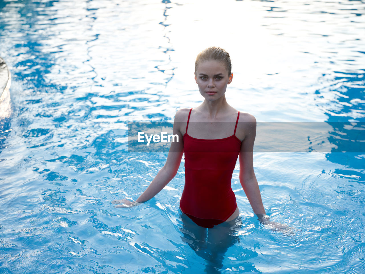 Portrait of young woman in swimming pool