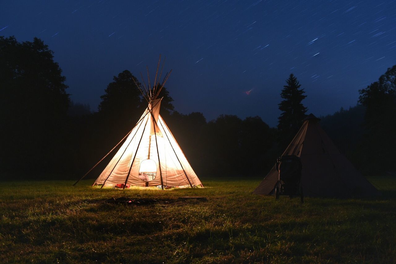 TENT ON FIELD AT NIGHT