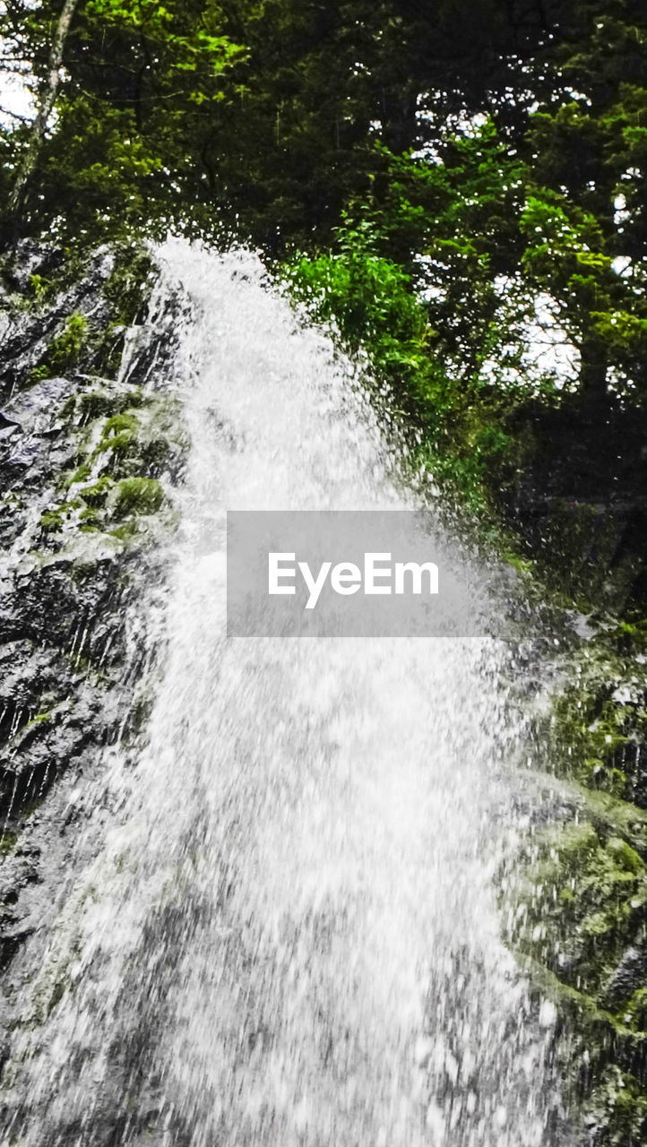 WATER FLOWING THROUGH ROCKS