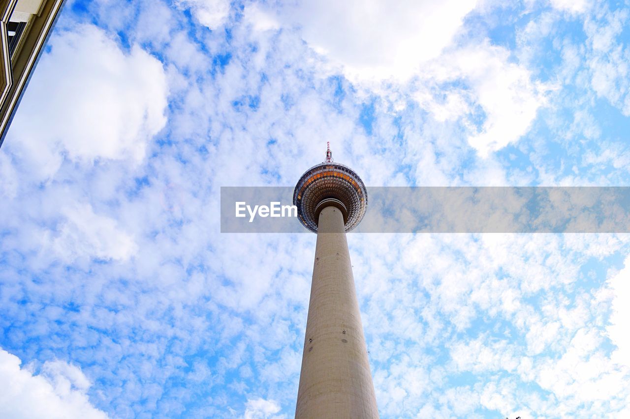 LOW ANGLE VIEW OF TOWER AGAINST CLOUDY SKY