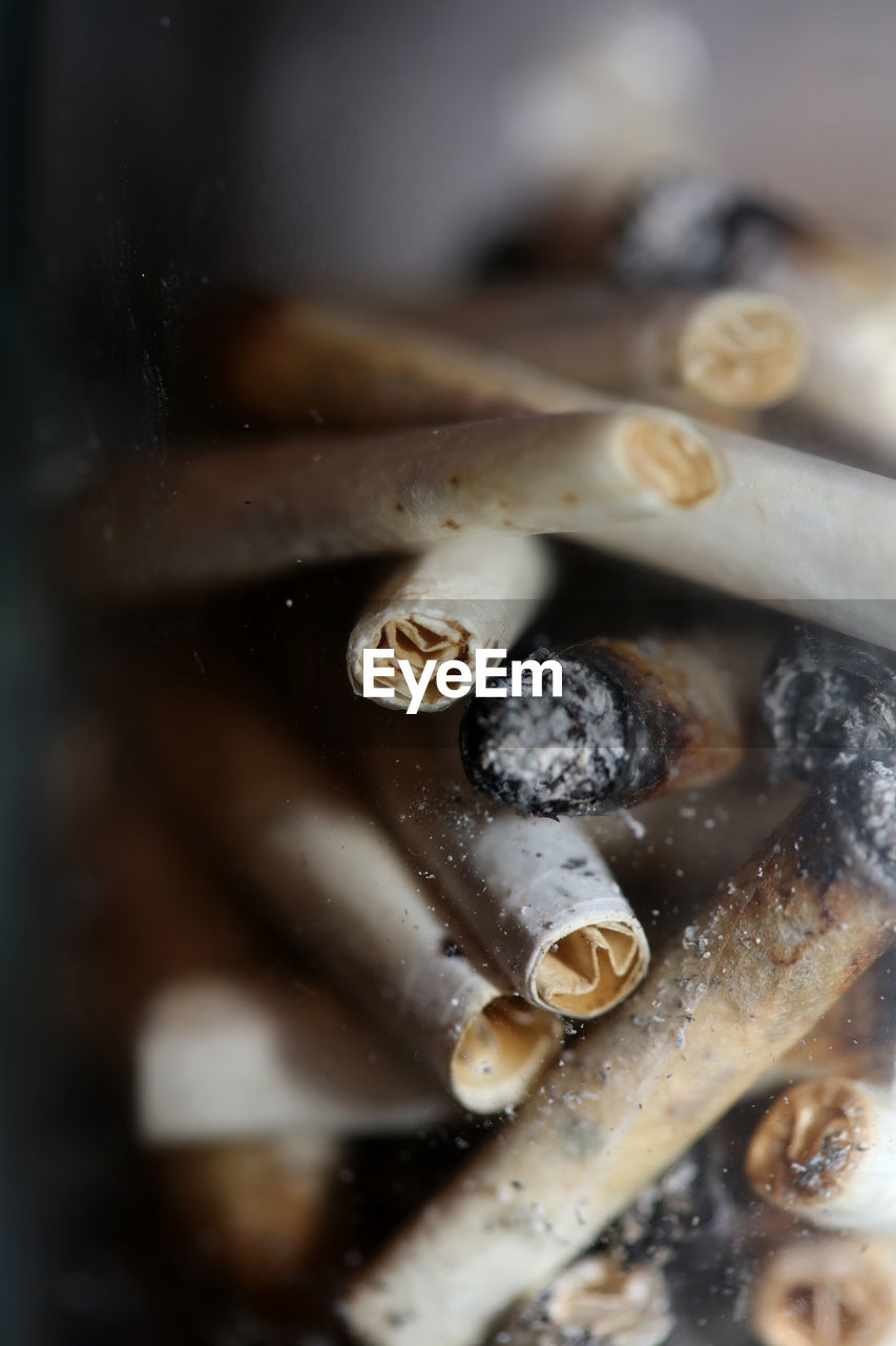 close-up, macro photography, tobacco products, no people, indoors, selective focus, social issues