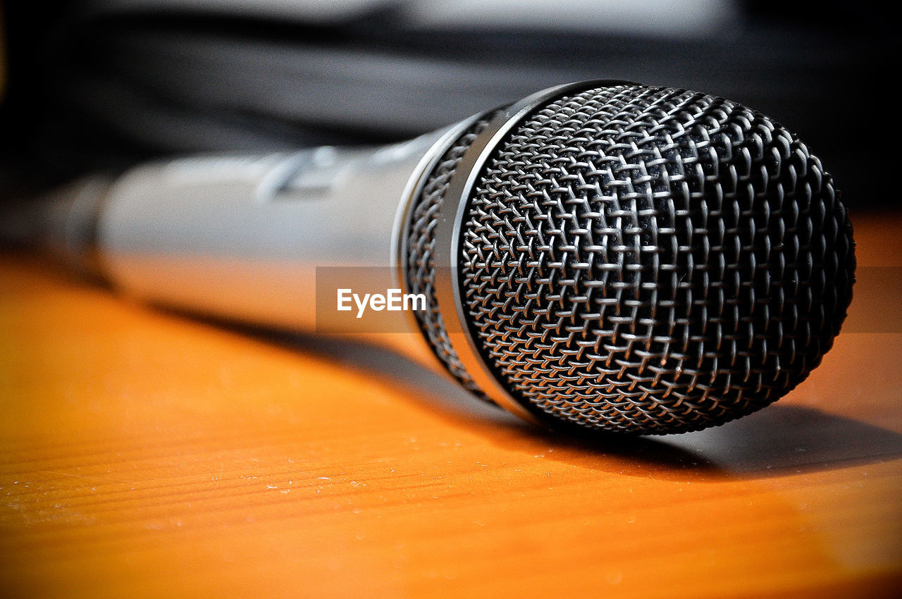 CLOSE-UP OF EYEGLASSES ON METAL TABLE