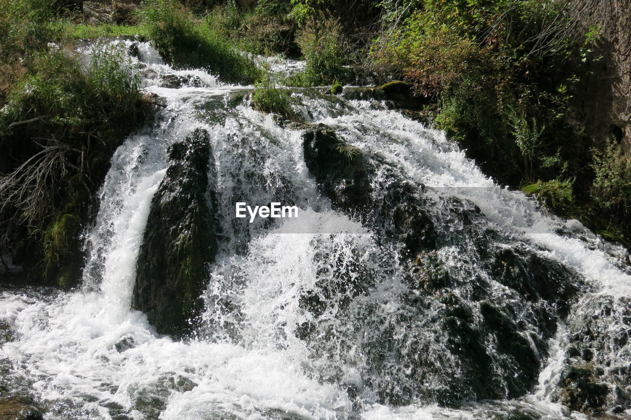 SCENIC VIEW OF WATERFALL