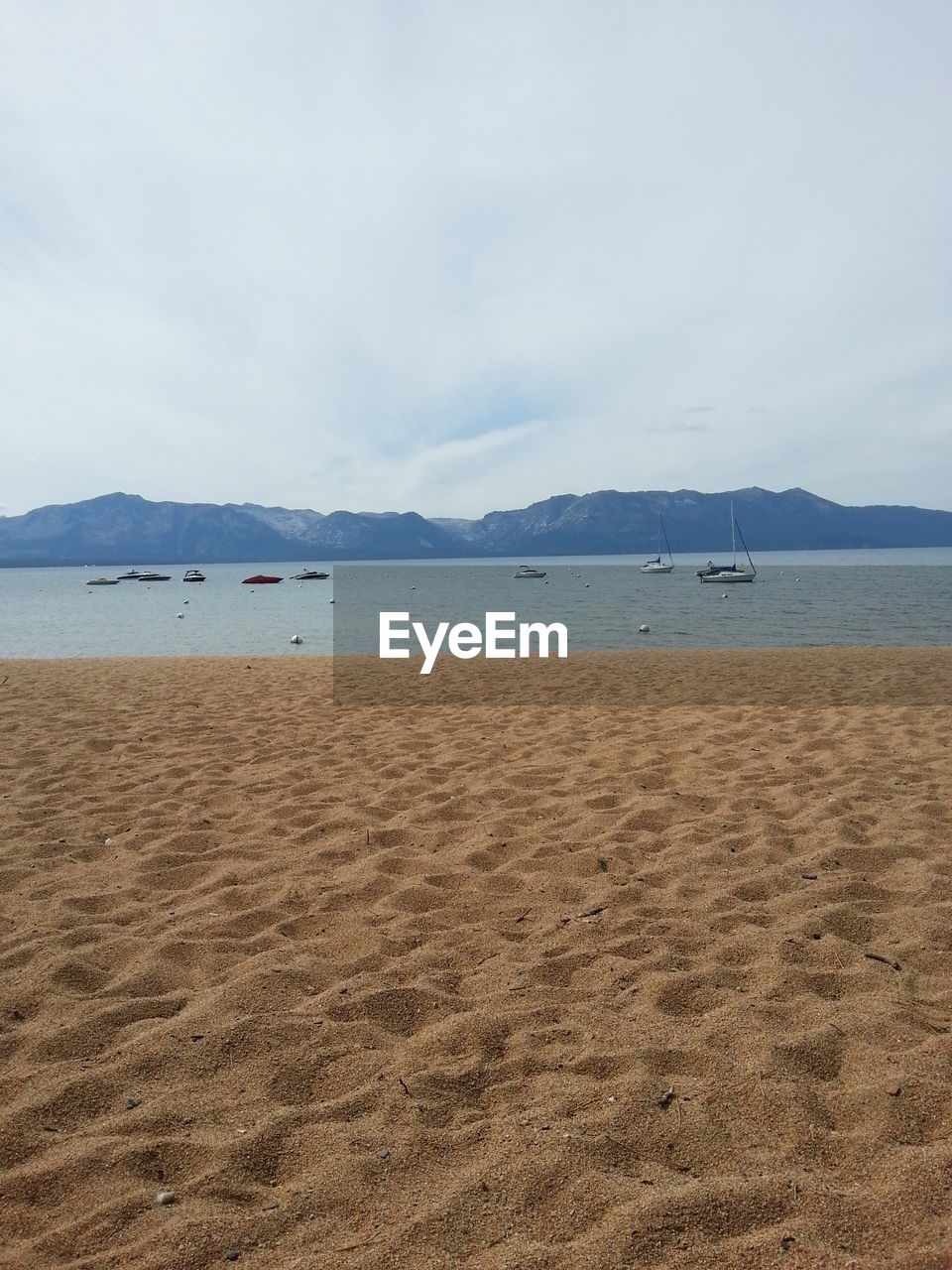 Scenic view of lake tahoe against sky