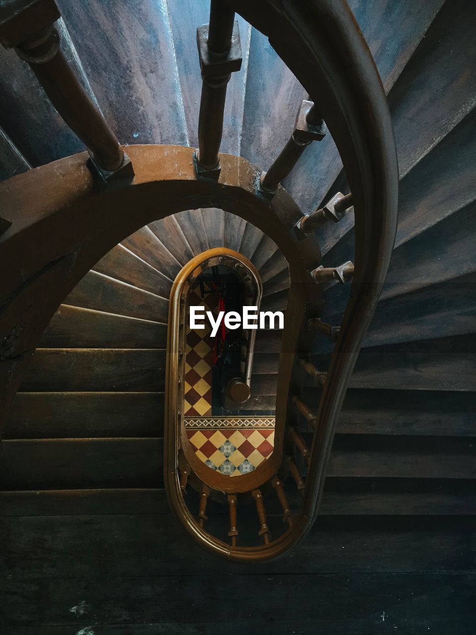 Directly above shot of empty spiral staircase in building