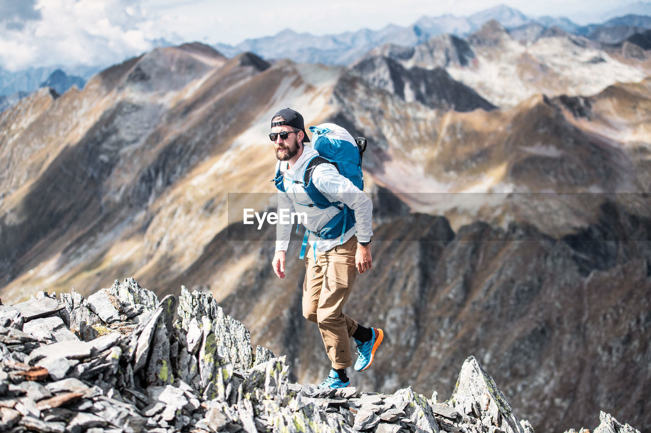 Man on alpine ridge of the italian alps