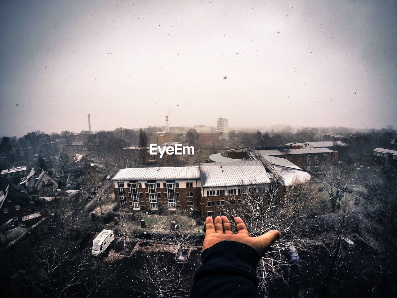 Cropped image of hand catching snow