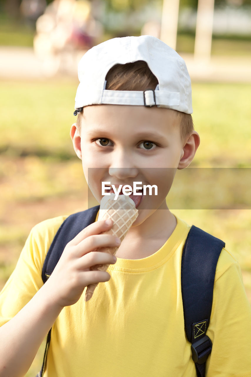 Portrait of boy holding ice cream