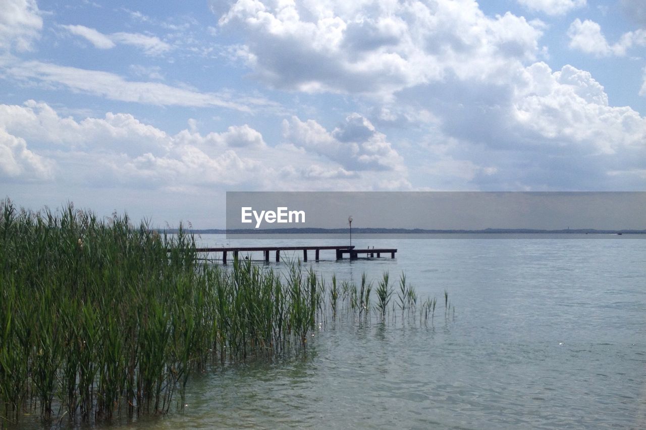 Scenic view of calm lake against clear sky