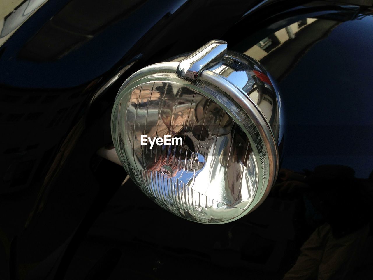 Close-up of vintage car headlight