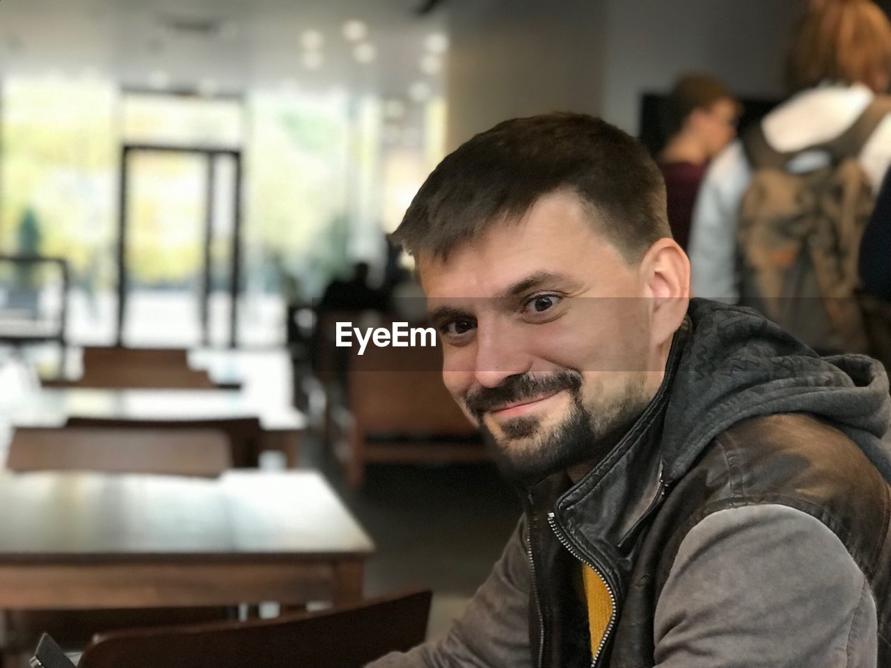 Portrait of smiling man at restaurant