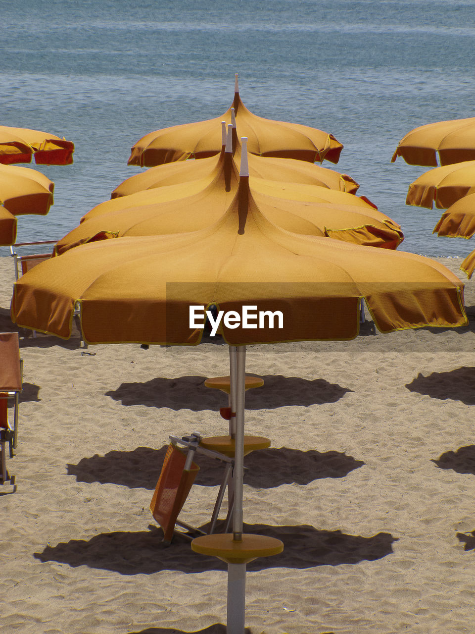 Lounge chairs and parasols on beach