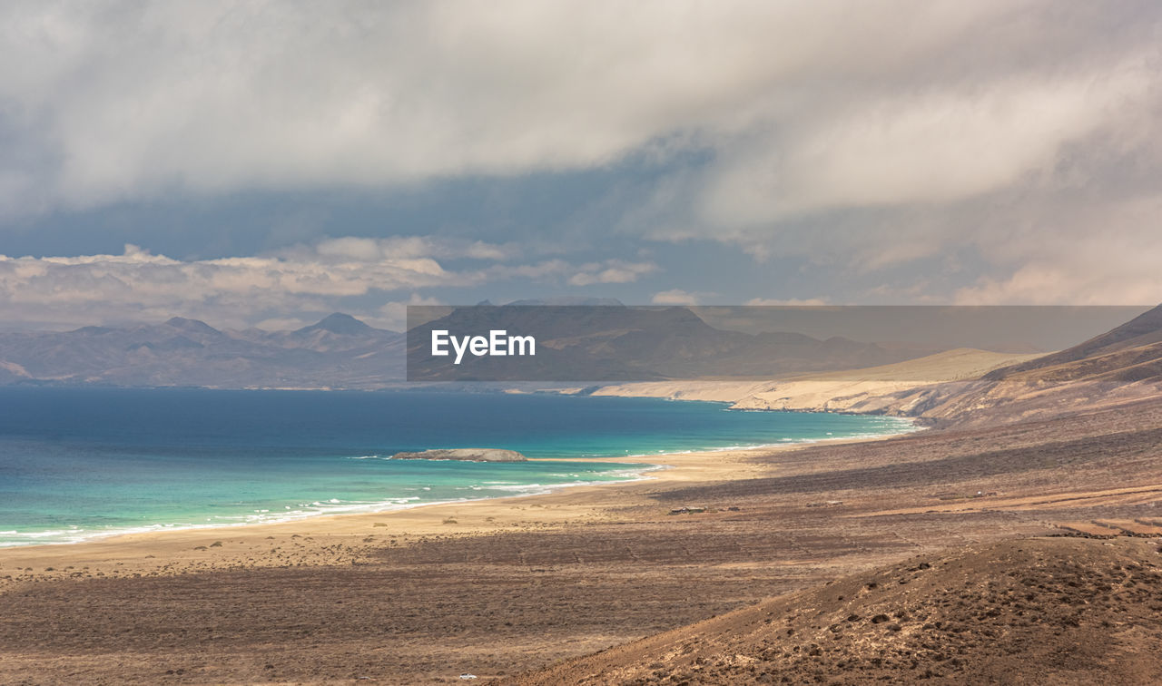 Scenic view of beach against sky