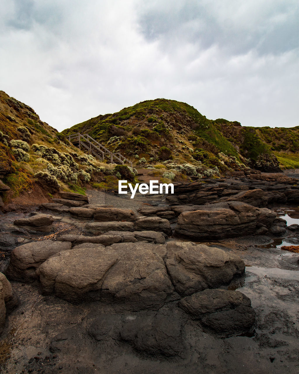 Rock formation on land against sky