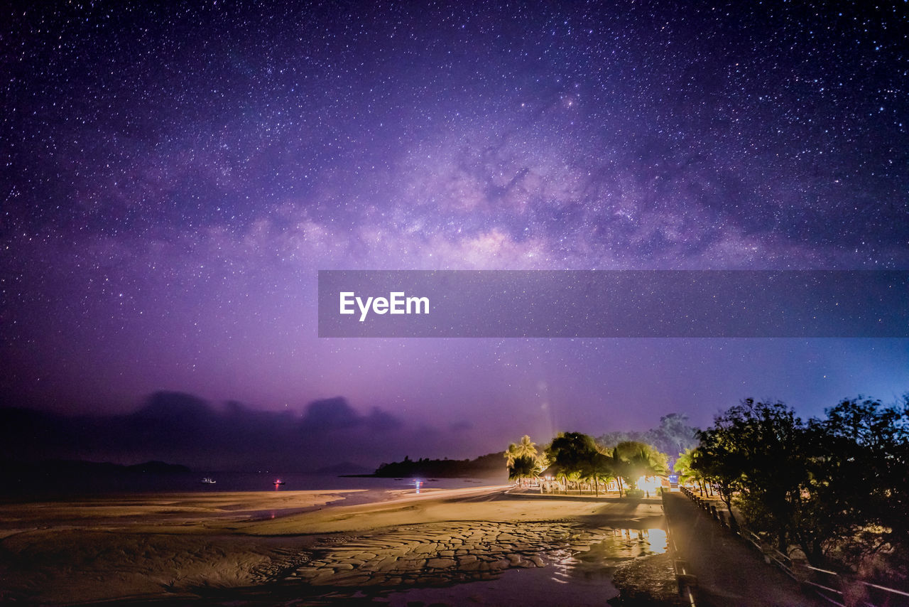 Scenic view of landscape against sky at night