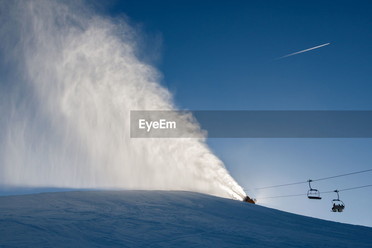 Low angle view of vapor trail against sky