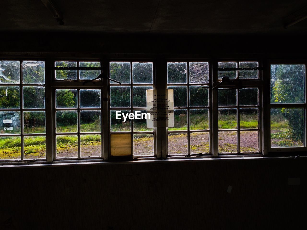 CLOSE-UP OF WINDOW AGAINST SKY