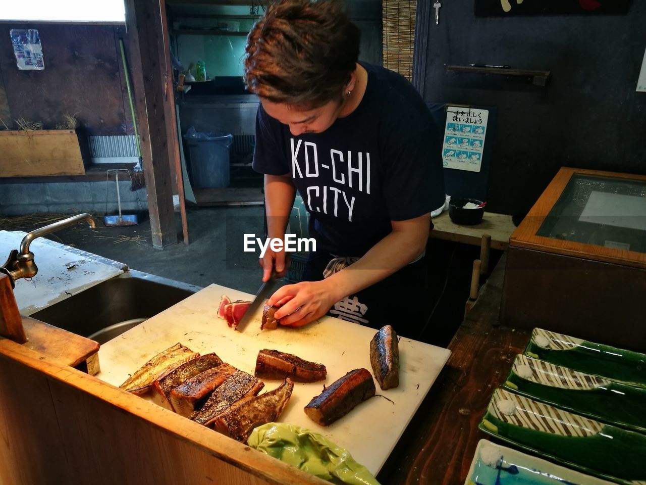 Man preparing food in commercial kitchen
