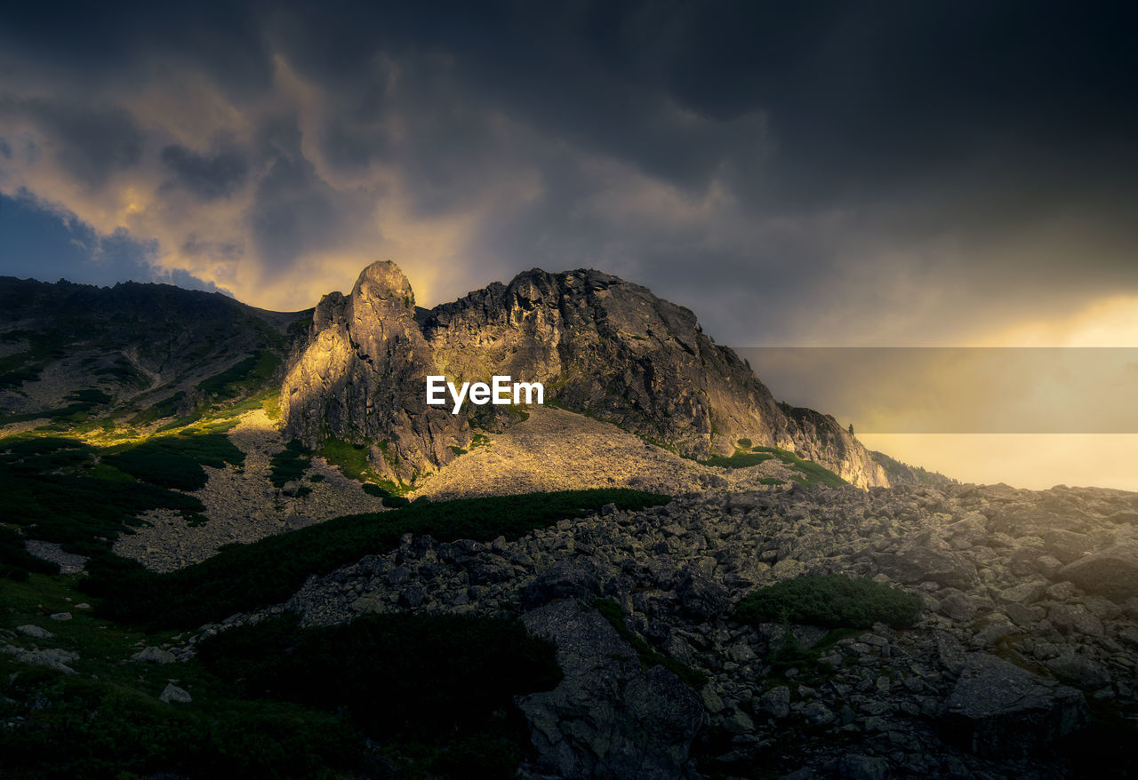 Scenic view of mountains against sky during sunset