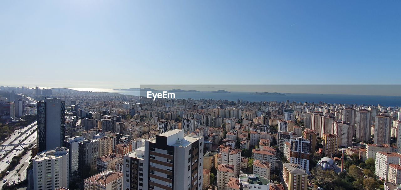 Aerial view of modern buildings against clear sky