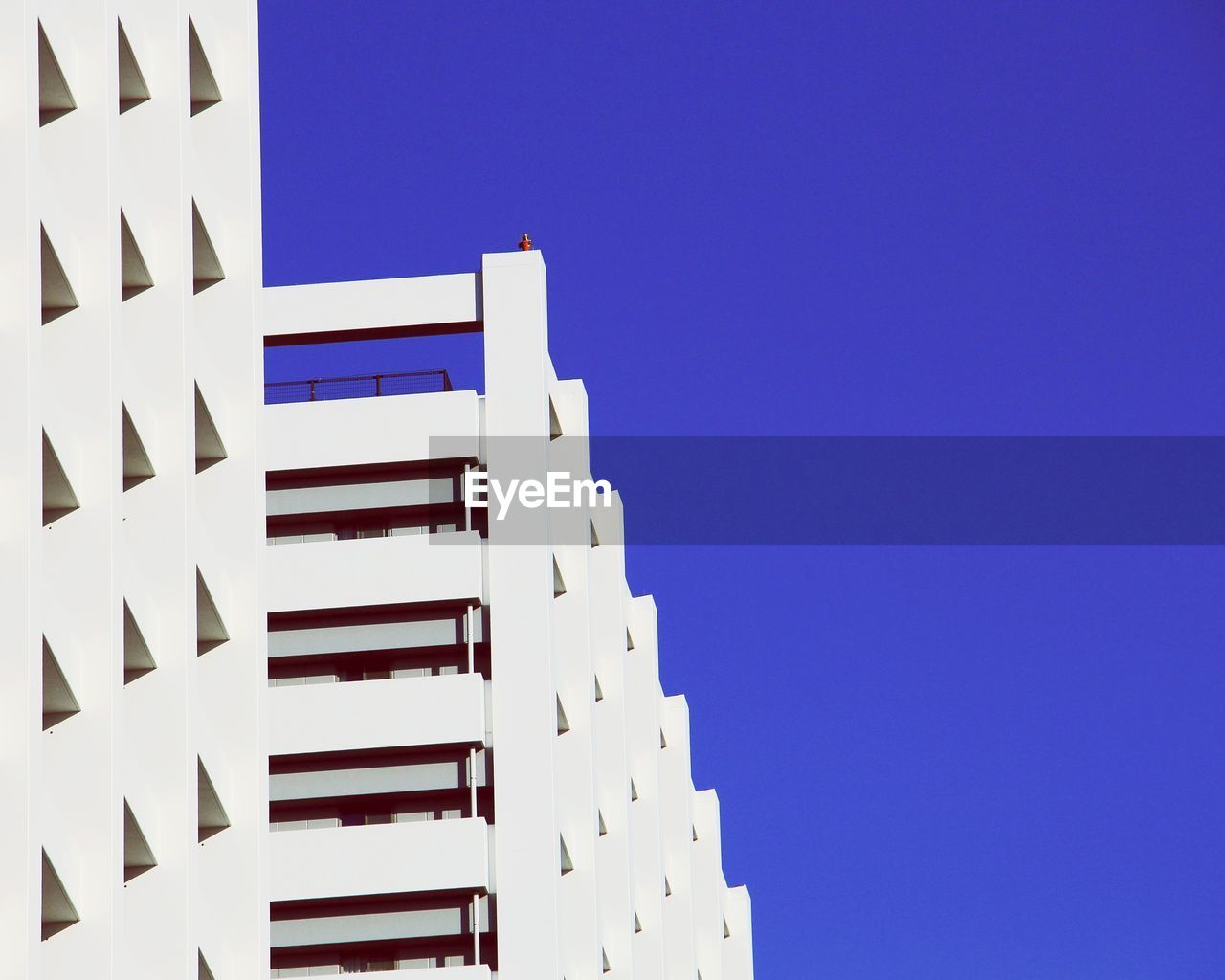 Low angle view of building against blue sky