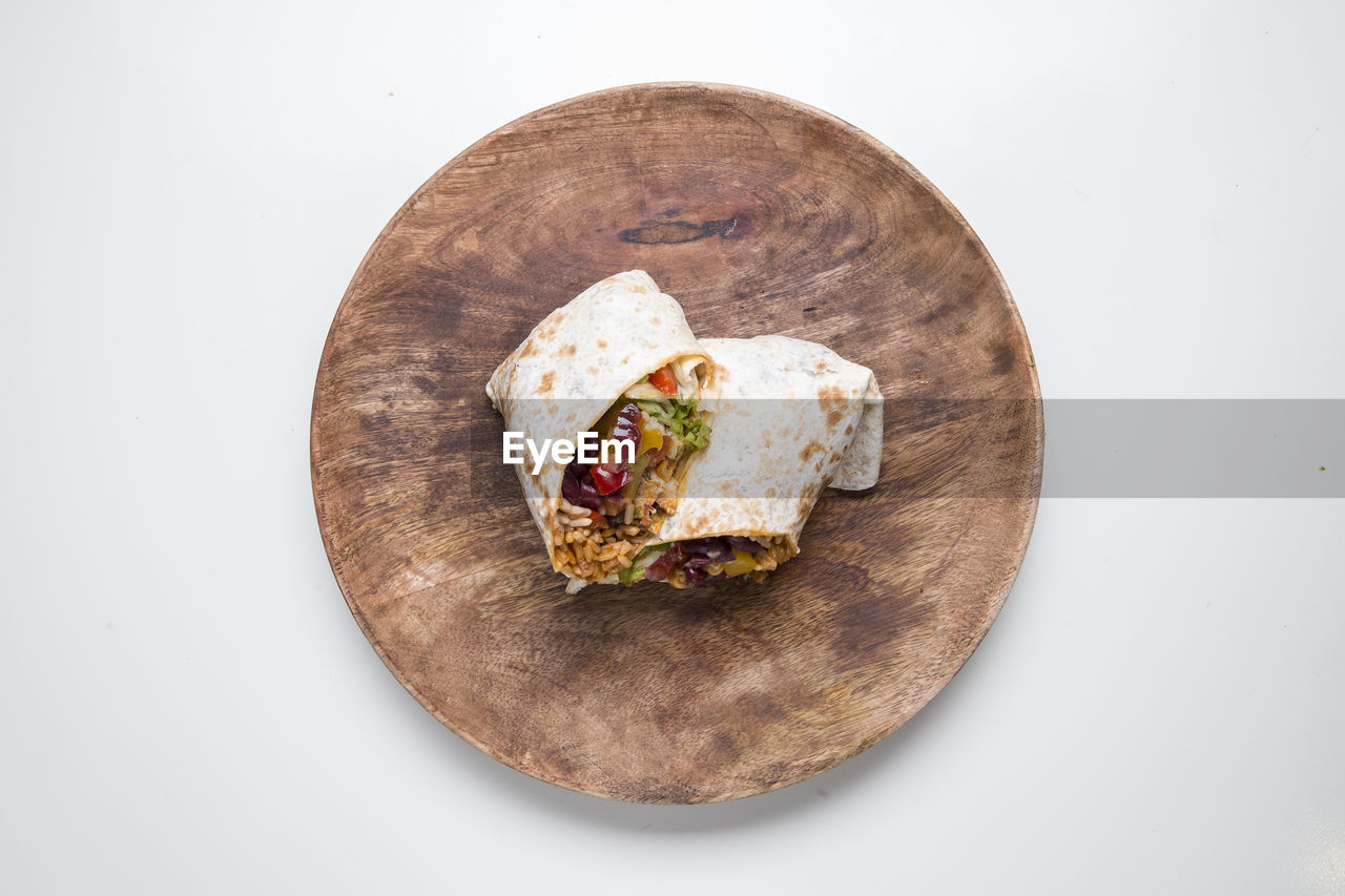 Directly above shot of wrap sandwich on table