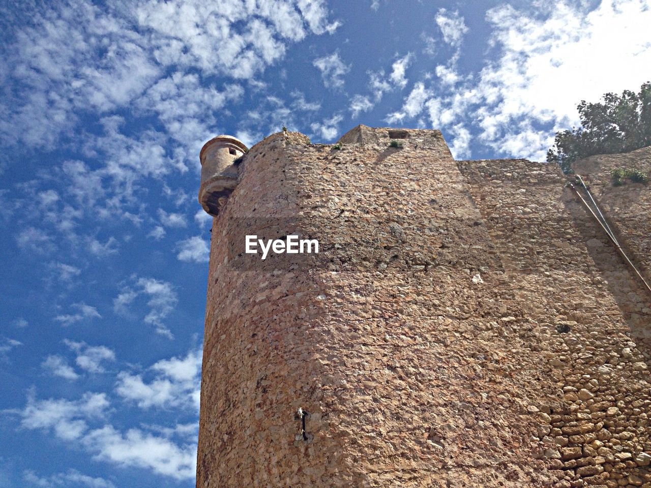 Low angle view of denia castle against sky