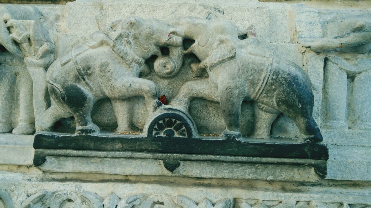 Elephant sculptures on wall