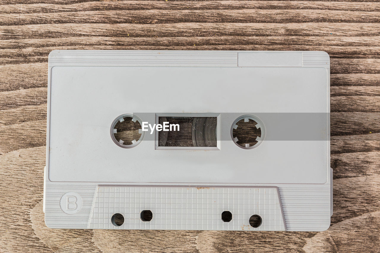 High angle view of cassette on wooden table