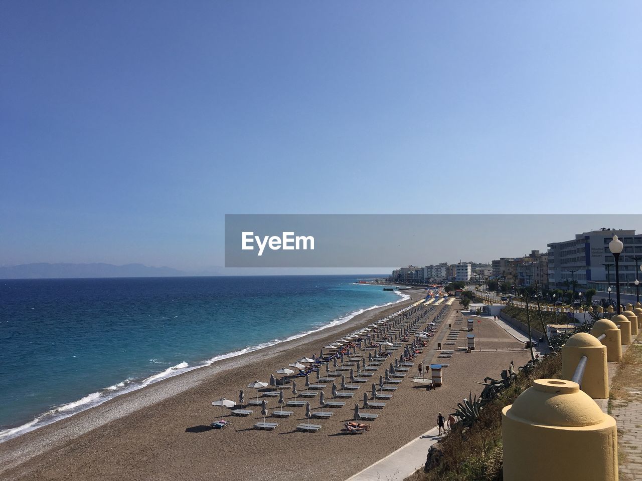 Scenic view of sea against clear blue sky