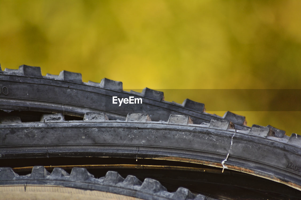 Close-up of wheels against blurred background
