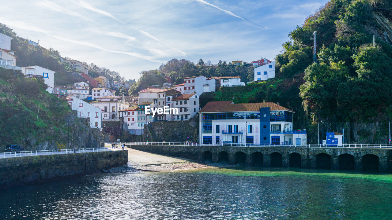 buildings by river
