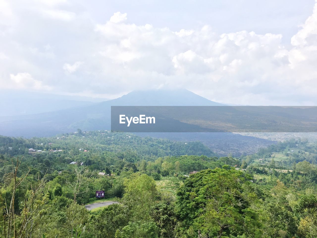 Scenic view of green landscape against sky