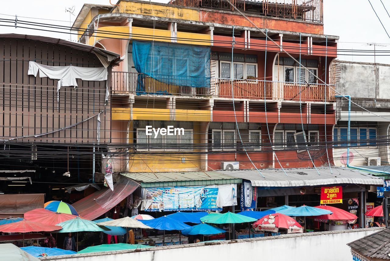 LOW ANGLE VIEW OF MULTI COLORED BUILDING