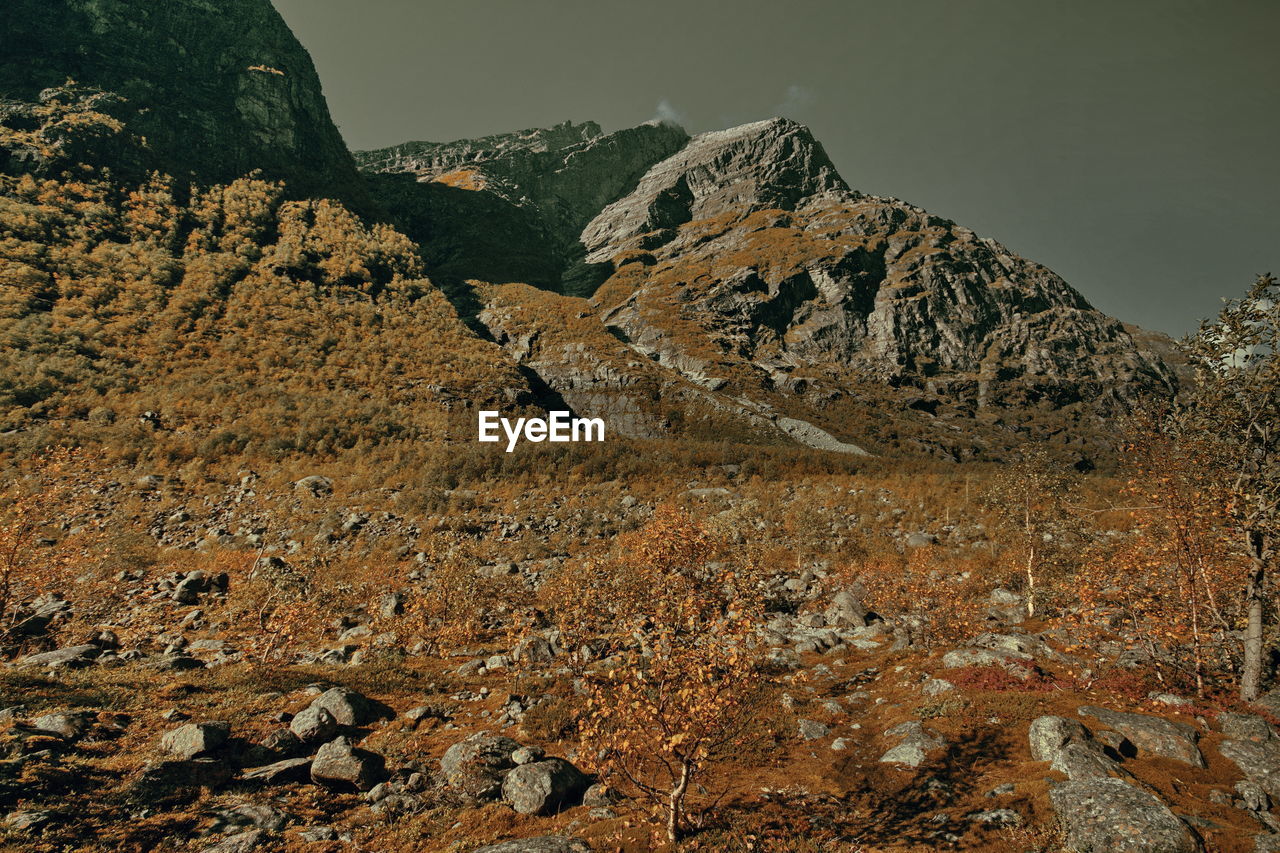 Rock formations on mountain against sky