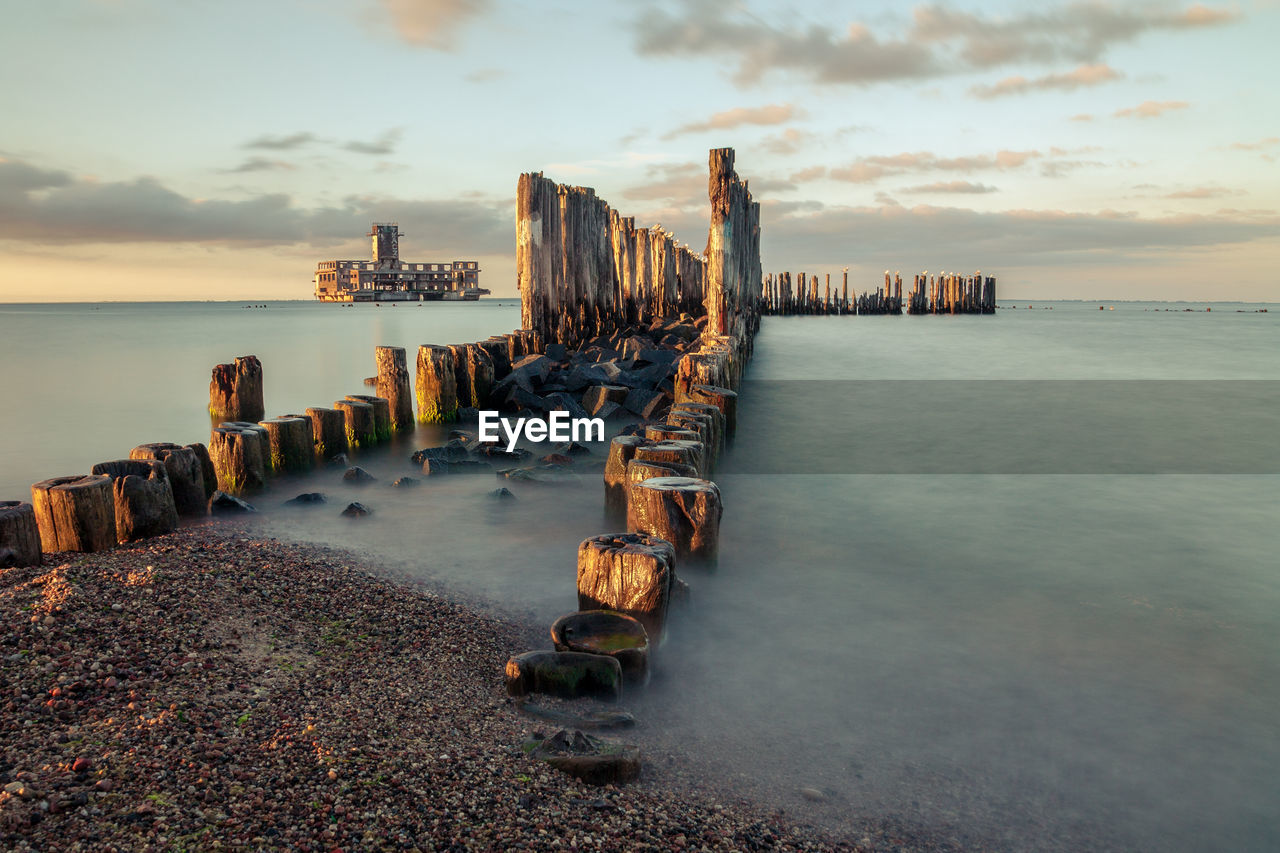 Scenic view of sea against sky at sunset