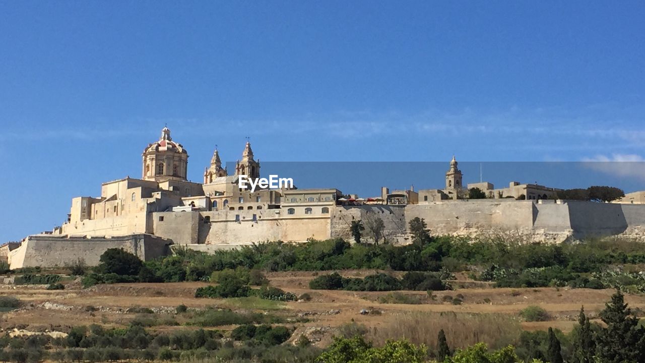 VIEW OF TEMPLE AGAINST BLUE SKY