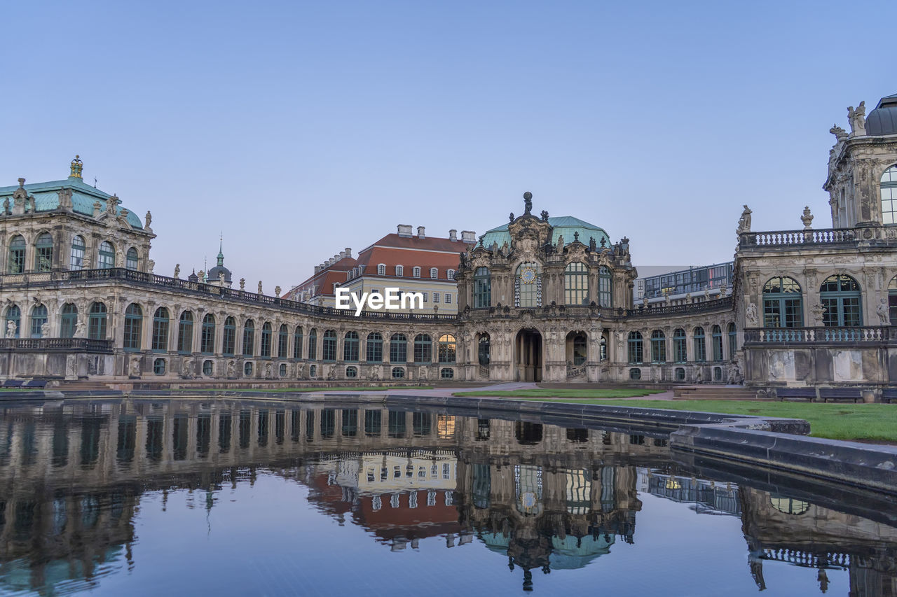 REFLECTION OF BUILDINGS IN WATER