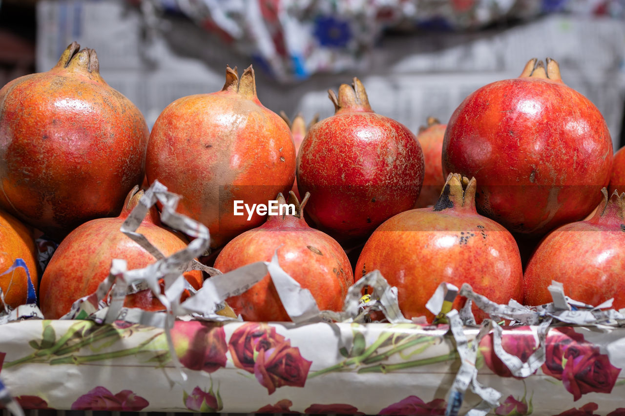 food and drink, food, healthy eating, fruit, pomegranate, freshness, wellbeing, produce, plant, red, no people, market, retail, close-up, abundance, large group of objects, outdoors, vegetable, nature, autumn