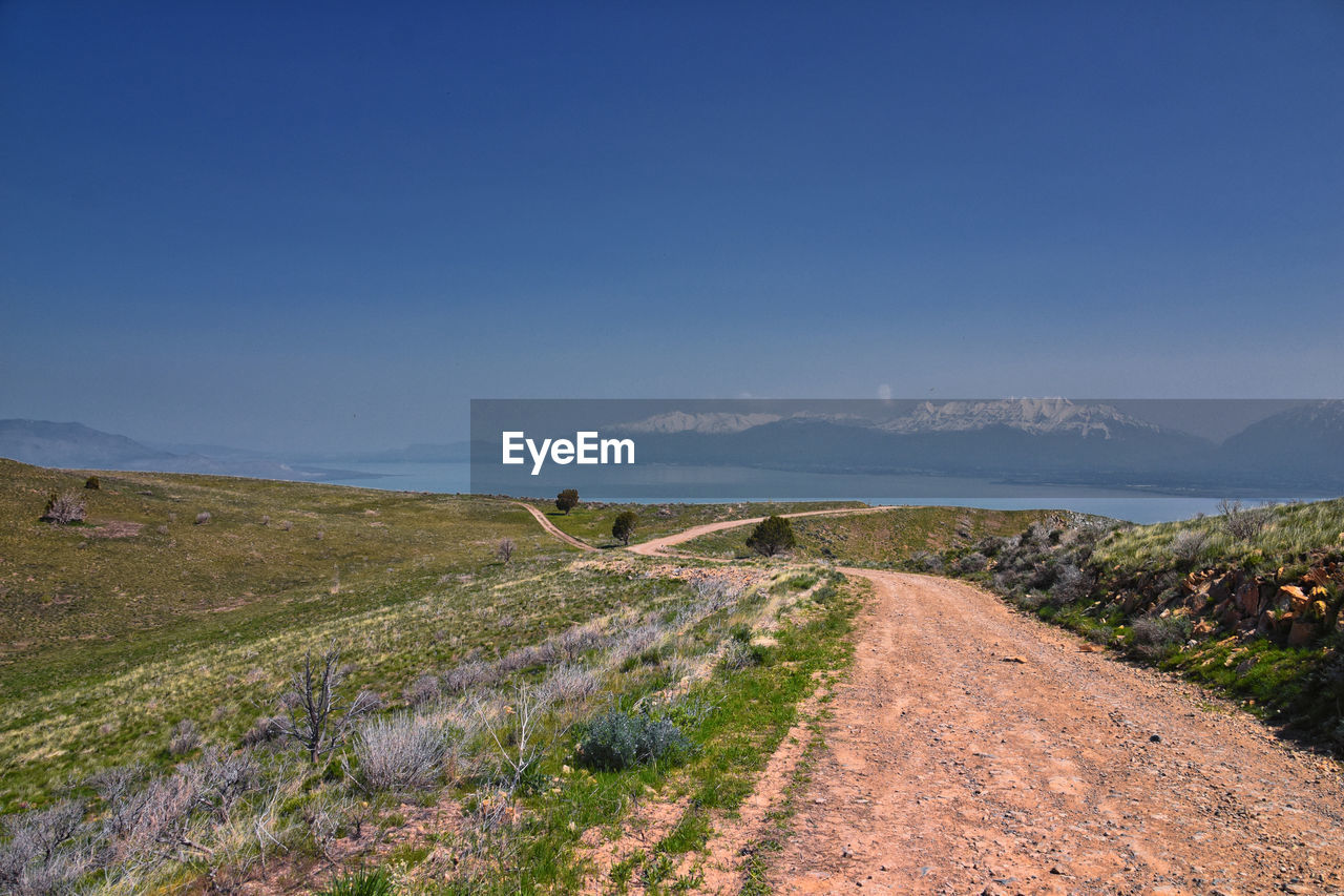 scenic view of sea against blue sky