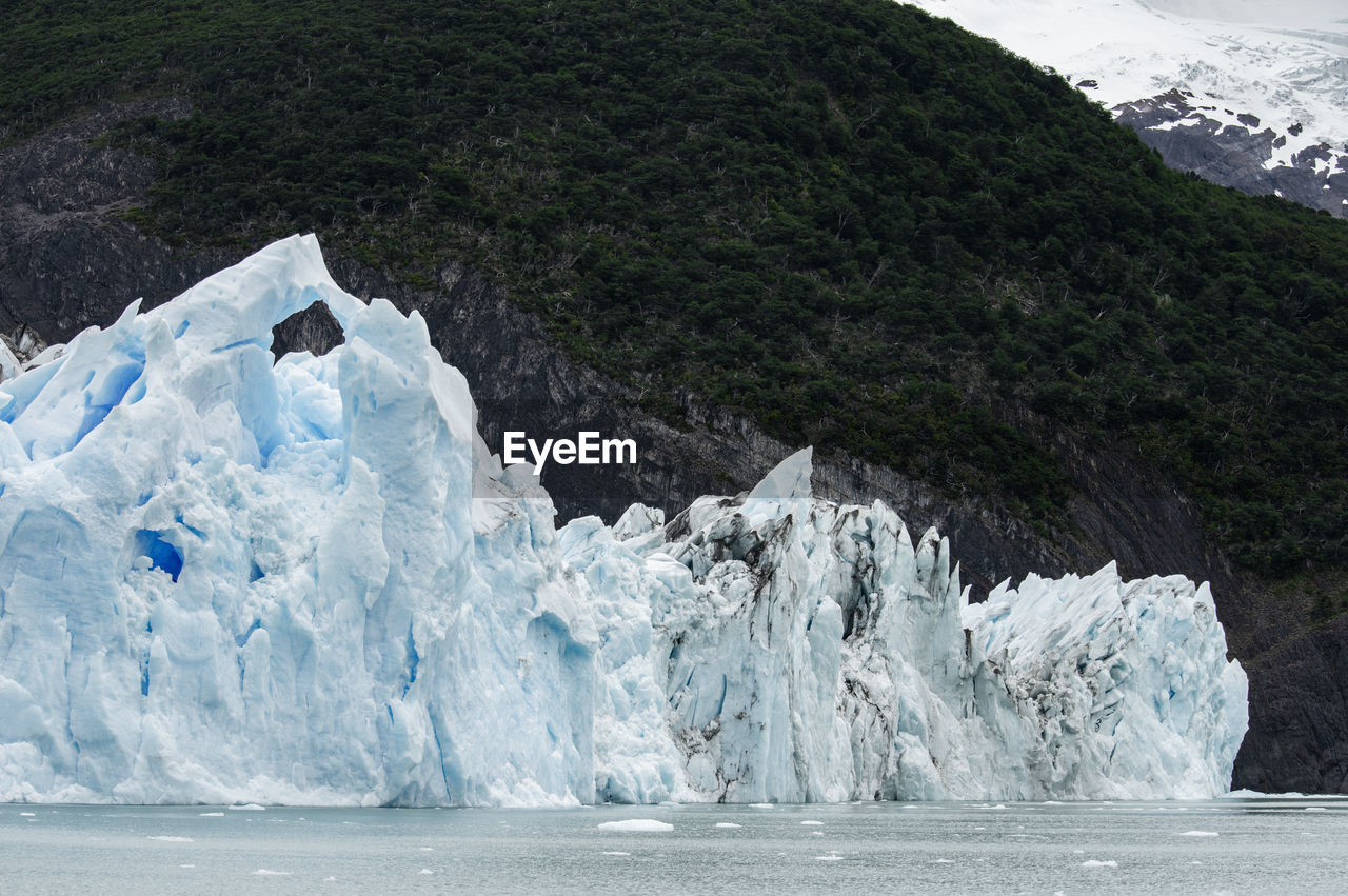 Scenic view of glacier against mountain